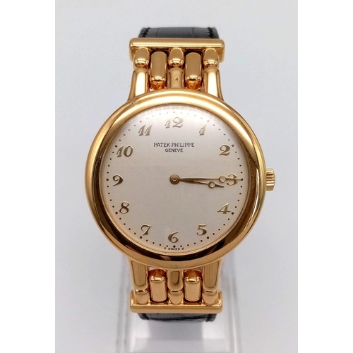 156 - A Patek Phillipe 18K Gold Calatrava Gents Watch. Leather strap with 18k gold buckle and extender. 18... 