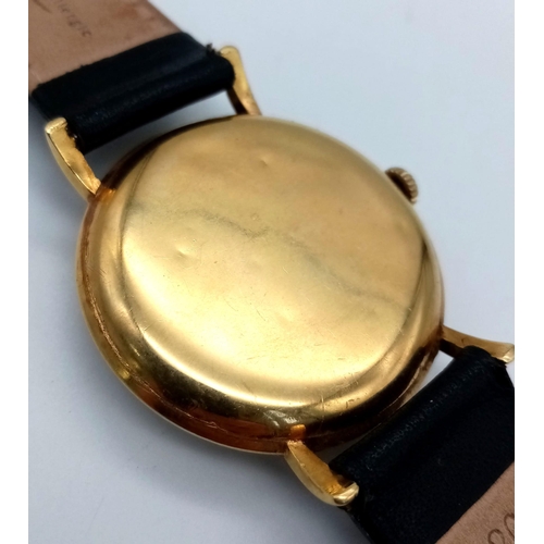 312 - AN 18K GOLD VINTAGE WRIST WATCH MADE BY THE INTERNATIONAL WATCH CO , MANUAL MOVEMENT, BLACK LEATHER ... 