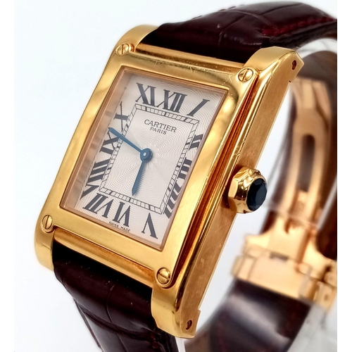 528 - A Cartier 18K Gold Ladies Tank Watch. Original strap with 18K gold extended clasp. 18K gold case - 2... 