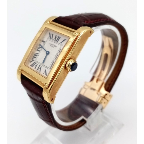 528 - A Cartier 18K Gold Ladies Tank Watch. Original strap with 18K gold extended clasp. 18K gold case - 2... 