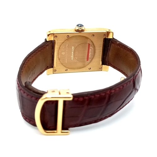 528 - A Cartier 18K Gold Ladies Tank Watch. Original strap with 18K gold extended clasp. 18K gold case - 2... 