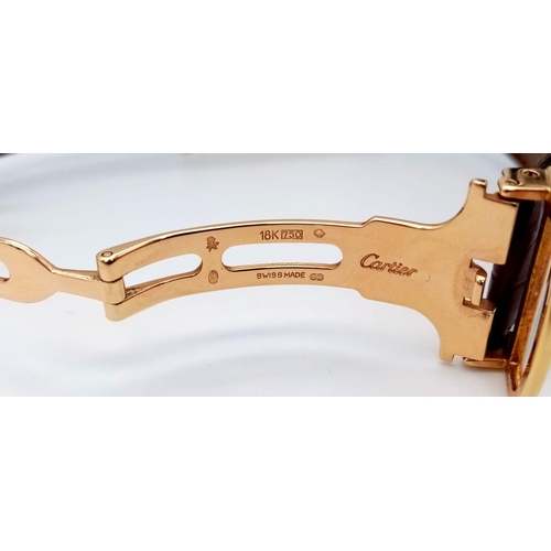 528 - A Cartier 18K Gold Ladies Tank Watch. Original strap with 18K gold extended clasp. 18K gold case - 2... 