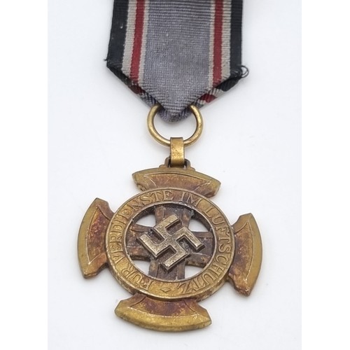 214 - A WW2 German 1st Class Luftschutz Medal – A hard to find award.