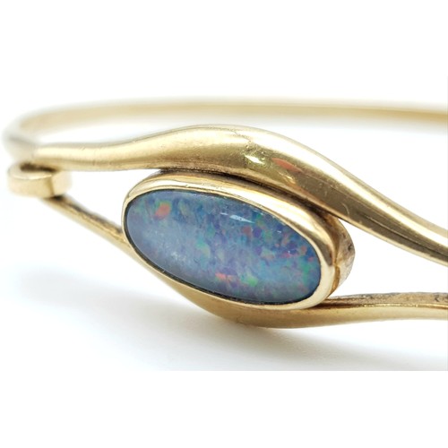 475 - A Vintage, Possibly Antique 9K Yellow Gold (tested) Opal Bangle. Central 15mm oval cut opal with hoo... 