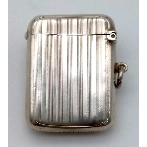 1031 - An Antique Sterling Silver Vesta Case. Birmingham 1909 hallmarks. 3.5 x 4.5cm. 27.7g