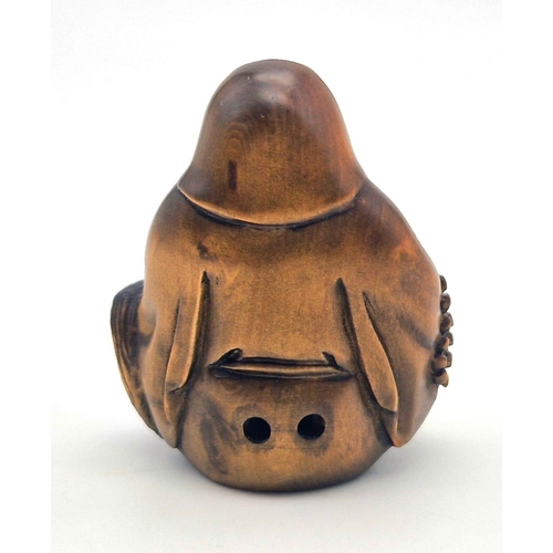 1107 - A Japanese Wooden Netsuke Figure. Marking on base. 5cm.