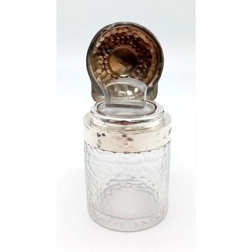 689 - A Sterling Silver Collar and Topped Glass Condiment Bottle. 9cm tall. 356g total weight.