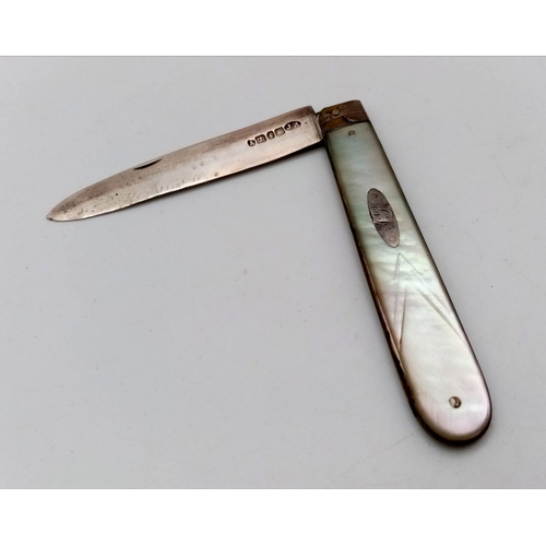 1093 - An Antique Sterling Silver and Mother of Pearl Fruit Knife. 14cm extended. Hallmarks for Sheffield 1... 