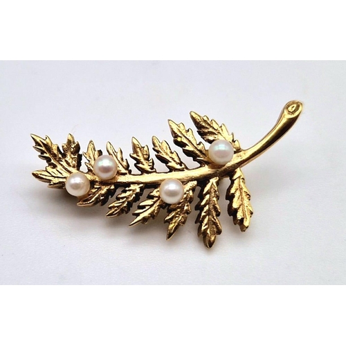 592 - A 9k Yellow Gold and Seed Pearl Leaf Brooch. 3.5cm. 3.36g total weight.