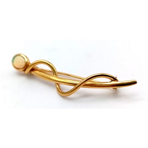 752 - An 18 K yellow gold brooch with an Australian opal cabochon. Length: 52 mm, weight: 3.41 g.