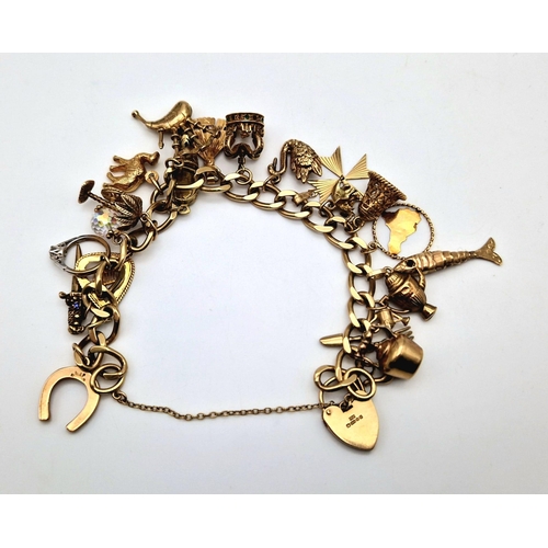 526 - A Vintage 9K Yellow Gold Charm Bracelet with a Heart Clasp and 21 gold charms. 45g total weight. 16c... 