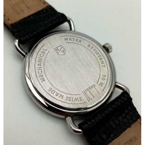 569 - A very elegant DUNHILL gents watch. 33 mm case , all streel construction with Swiss mechanical movem... 