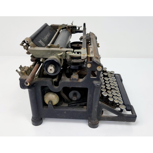 688 - Two Rare Antique Machines - An Underwood Typewriter and a W.J.H. and Co sewing machine. As found.