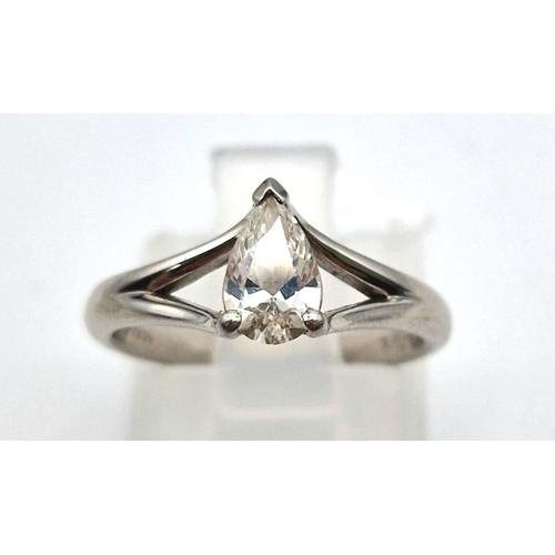 890 - A platinum solitaire ring with a pear cut diamond. Ring size I, weight: 3.87 g.