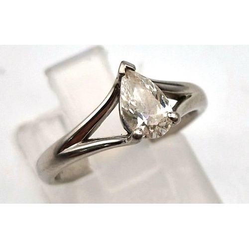 890 - A platinum solitaire ring with a pear cut diamond. Ring size I, weight: 3.87 g.