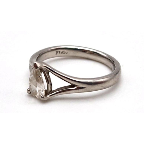 890 - A platinum solitaire ring with a pear cut diamond. Ring size I, weight: 3.87 g.