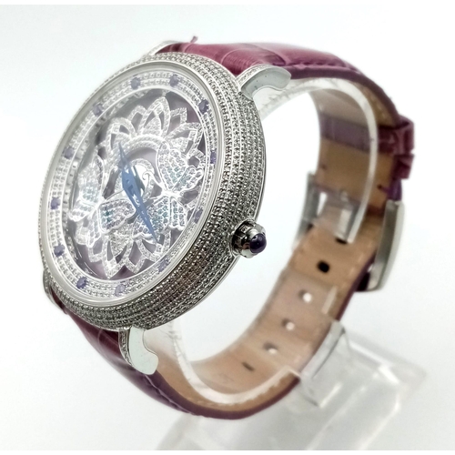 253 - A rare OUBUS, watch. Case diameter: 42 mm, crystal encrusted bezel, freely rotating ornate disc on f... 