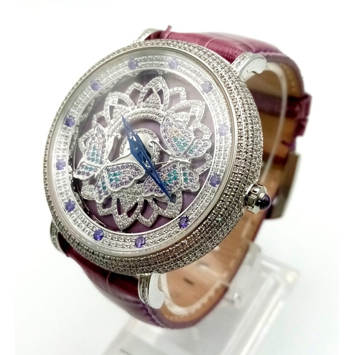 253 - A rare OUBUS, watch. Case diameter: 42 mm, crystal encrusted bezel, freely rotating ornate disc on f... 