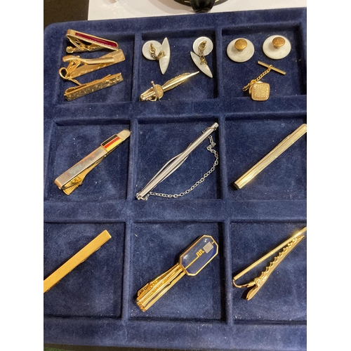 336 - Large selection of vintage tie clips,tie pins and shirt studs, together with Canadian money clip.Pre... 