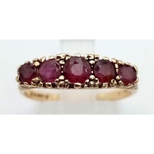 610 - 9K YELLOW GOLD VINTAGE 5 RUBY SET RING, WEIGHT 2.6G SIZE O