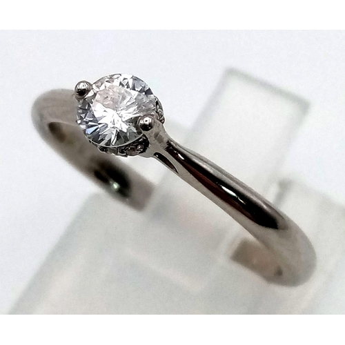 109 - A platinum solitaire diamond (0.25 carats) ring. Size: M, weight: 2.3 g.