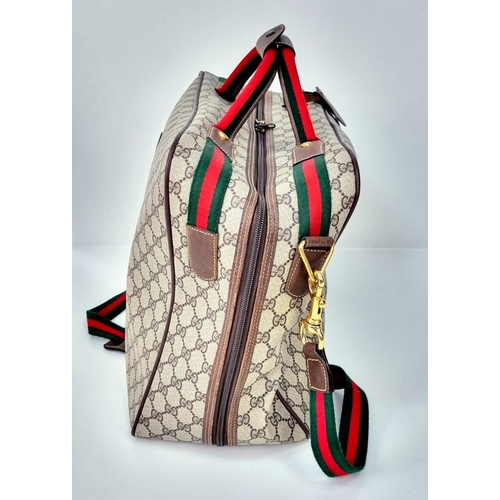 157 - A Gucci Ophidia Small Suitcase/Carry On. Gucci monogram canvas exterior. Red and green handles with ... 