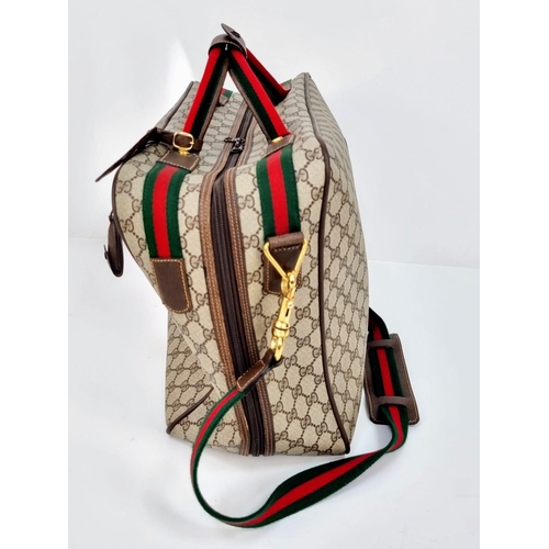 157 - A Gucci Ophidia Small Suitcase/Carry On. Gucci monogram canvas exterior. Red and green handles with ... 