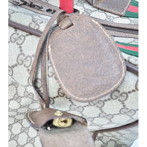 157 - A Gucci Ophidia Small Suitcase/Carry On. Gucci monogram canvas exterior. Red and green handles with ... 