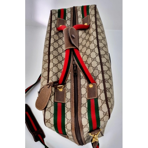 157 - A Gucci Ophidia Small Suitcase/Carry On. Gucci monogram canvas exterior. Red and green handles with ... 