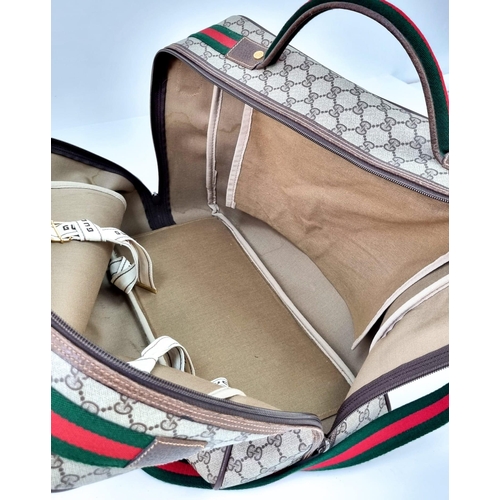 157 - A Gucci Ophidia Small Suitcase/Carry On. Gucci monogram canvas exterior. Red and green handles with ... 