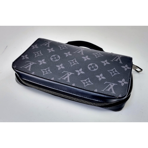 17 - A Louis Vuitton Zippy XL Gents Wallet. Monogram grey exterior. Large middle zipped compartment. Plen... 