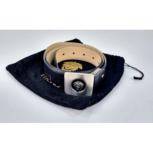 178 - A Versace Black Leather Gents Belt - Buckle with Emblem. Comes with a dust cover. 38 inches. In very... 