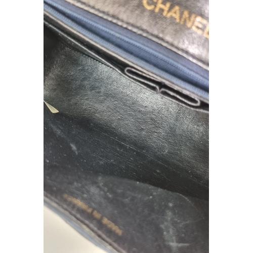 1 - A Classic Chanel Navy Blue Calfskin Flap Bag. Gilded hardware with the iconic Chanel clasp. Leather ... 