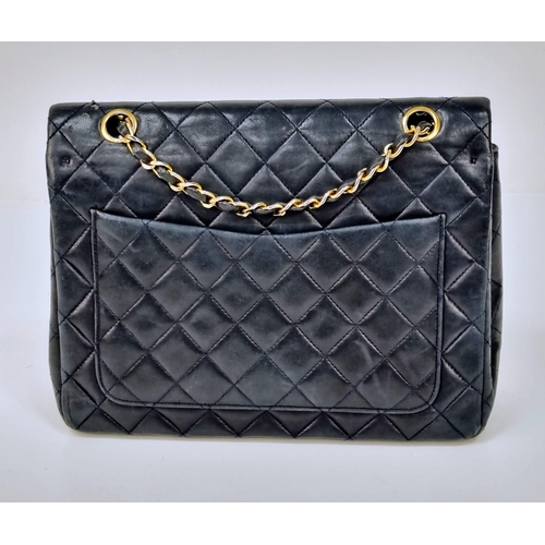 1 - A Classic Chanel Navy Blue Calfskin Flap Bag. Gilded hardware with the iconic Chanel clasp. Leather ... 