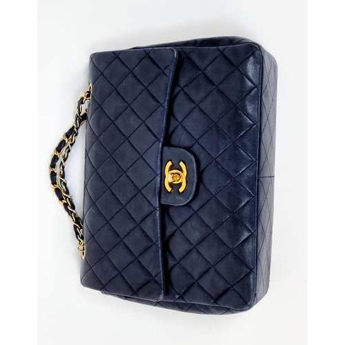 1 - A Classic Chanel Navy Blue Calfskin Flap Bag. Gilded hardware with the iconic Chanel clasp. Leather ... 