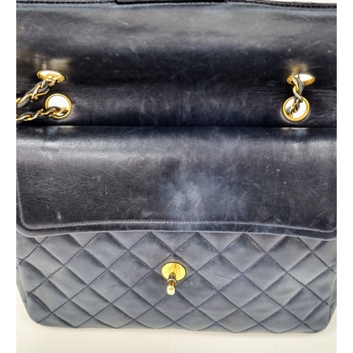 1 - A Classic Chanel Navy Blue Calfskin Flap Bag. Gilded hardware with the iconic Chanel clasp. Leather ... 