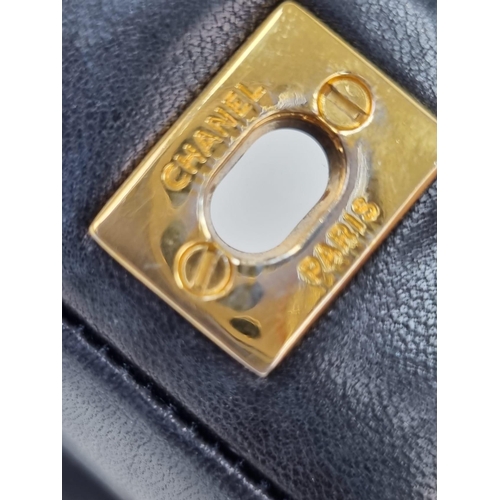 1 - A Classic Chanel Navy Blue Calfskin Flap Bag. Gilded hardware with the iconic Chanel clasp. Leather ... 