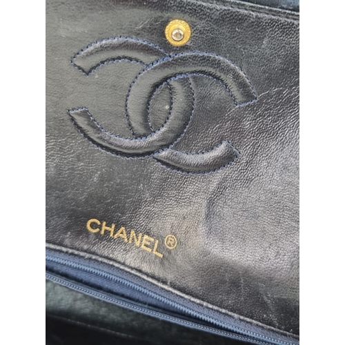 1 - A Classic Chanel Navy Blue Calfskin Flap Bag. Gilded hardware with the iconic Chanel clasp. Leather ... 