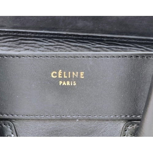 270 - A Celine of Paris Black Leather Small Tote Bag. Exterior pocket for convenience. Interior zipped and... 