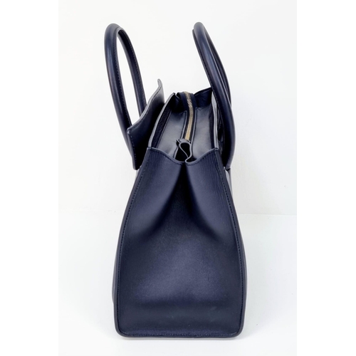 270 - A Celine of Paris Black Leather Small Tote Bag. Exterior pocket for convenience. Interior zipped and... 