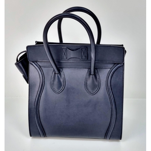 270 - A Celine of Paris Black Leather Small Tote Bag. Exterior pocket for convenience. Interior zipped and... 