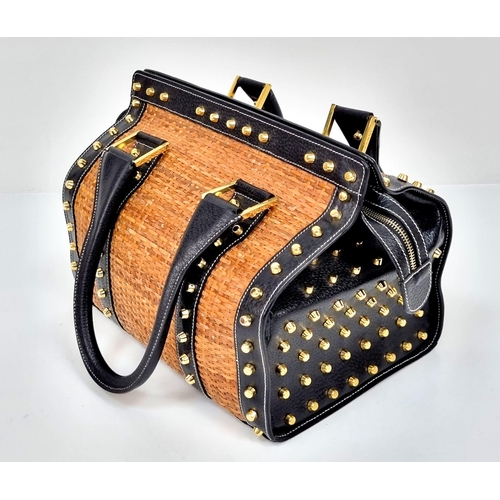 291 - A Wonderful Fendi Rattan Bag. Interwoven straw and leather exterior. Gilded studs throughout. Cloth ... 