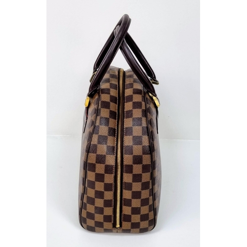 309 - A Louis Vuitton Classic Bowling Bag. Checked canvas exterior with gilded hardware. Cloth interior wi... 