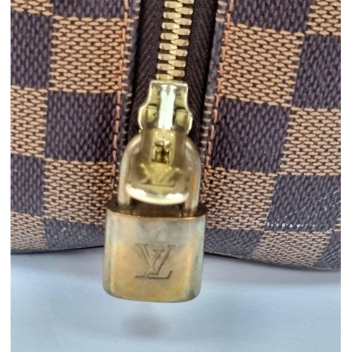 309 - A Louis Vuitton Classic Bowling Bag. Checked canvas exterior with gilded hardware. Cloth interior wi... 