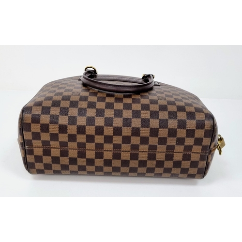 309 - A Louis Vuitton Classic Bowling Bag. Checked canvas exterior with gilded hardware. Cloth interior wi... 