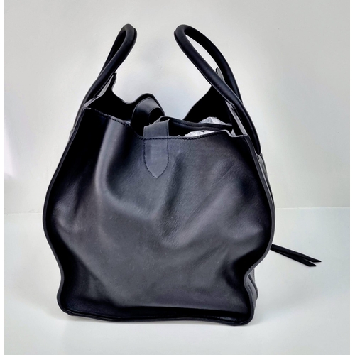 45 - A Celine of Paris Black Leather Tote Bag. Rich black leather exterior with a zipped compartment. Bla... 