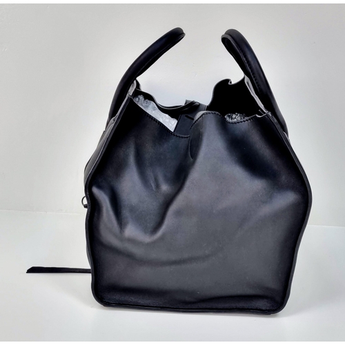 45 - A Celine of Paris Black Leather Tote Bag. Rich black leather exterior with a zipped compartment. Bla... 