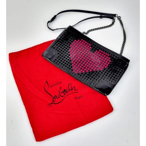 464 - A Christian Louboutin Patent Leather Valentine Clutch Bag.
Black and red exterior studs. Red cloth i... 