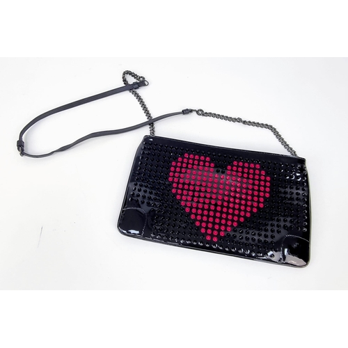 464 - A Christian Louboutin Patent Leather Valentine Clutch Bag.
Black and red exterior studs. Red cloth i... 