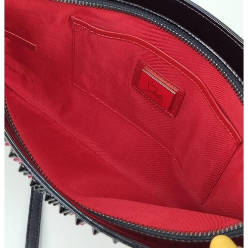 464 - A Christian Louboutin Patent Leather Valentine Clutch Bag.
Black and red exterior studs. Red cloth i... 